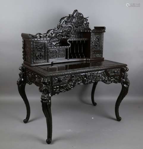 A Japanese carved and lacquered softwood writing desk