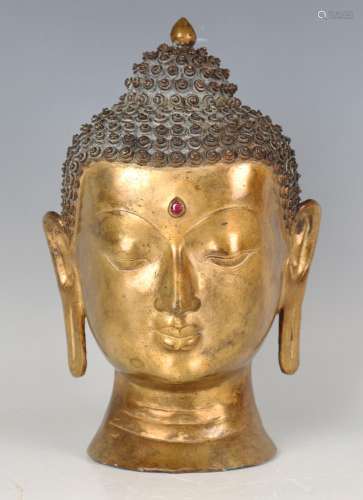 A Sino-Tibetan gilt bronze head of Buddha