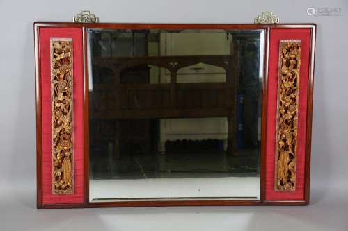 A Chinese hardwood framed rectangular wall mirror