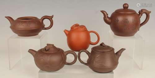 A group of five Chinese Yixing stoneware teapots and four co...