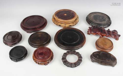 A collection of twenty-two Chinese wood stands