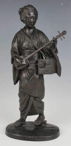 A Japanese brown patinated bronze figure of a bijin musician