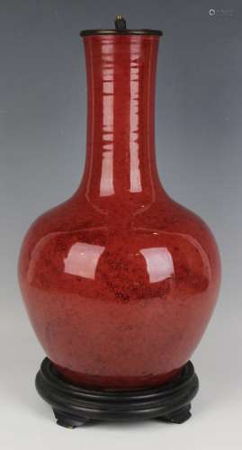 A Chinese sang-de-boeuf glazed porcelain bottle vase