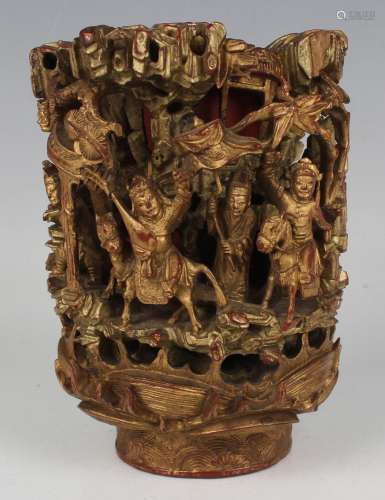 A Chinese carved and pierced giltwood and red lacquered fini...