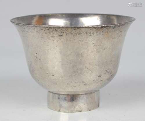 A Chinese white metal wine cup