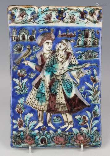 A Qajar pottery rectangular tile