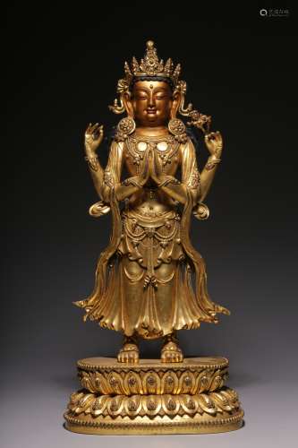 Bronze gilt statue of Guanyin with four arms in Ming Dynasty