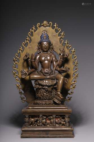 In the Qing Dynasty, a seated statue of Guanyin with six arm...