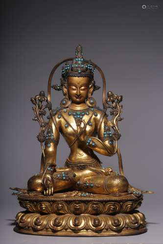 In the Qing Dynasty, a white Tara statue inlaid with gilt co...