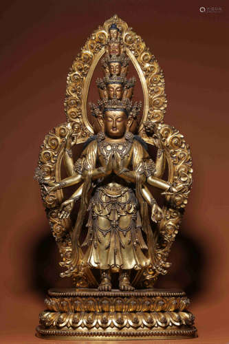 In Ming Dynasty, bronze gilt statue of Guanyin with eight ar...