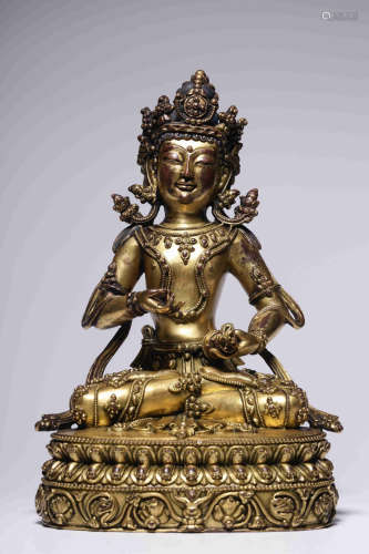 In the Qing Dynasty, a bronze gilt King Kong holding a sitti...