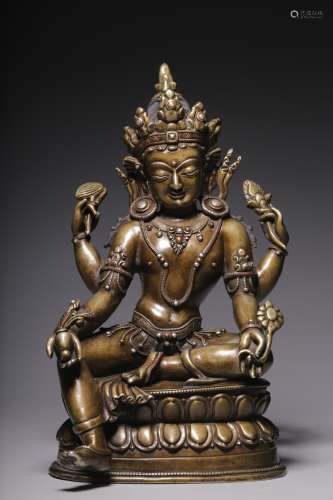 In the Qing Dynasty, a seated statue of Guanyin with four ar...