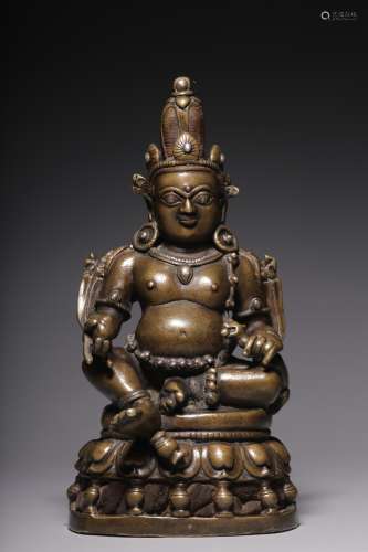In the Qing Dynasty, a seated statue of the God of Wealth in...