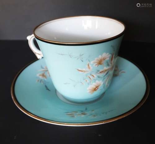 Coffee cup with light blue ground and floral decor