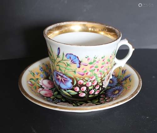 Large coffee cup with saucer