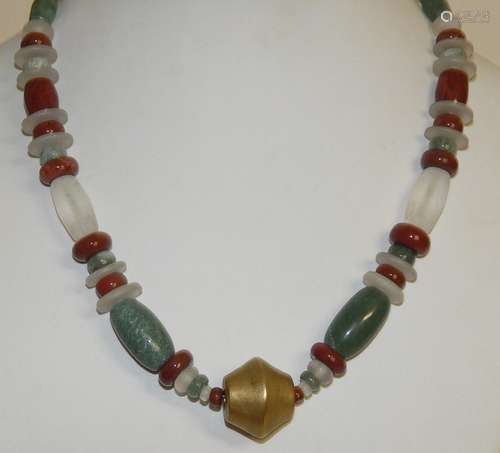 Long necklace with brass element and semi-precious stone tri...