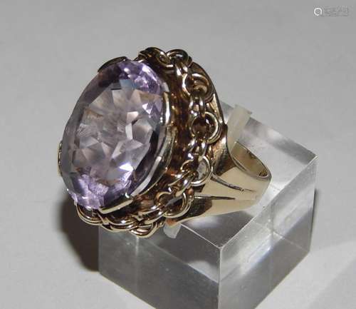 Ladies ring with large amethyst cabochon and heavy ring moun...