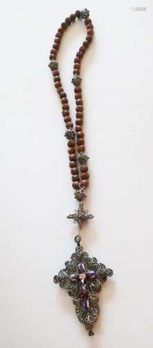 Rosary with carved wooden beads and filigree worked silver c...