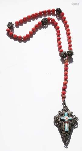 Long rosary with orange-red cut beads and filigree worked ba...