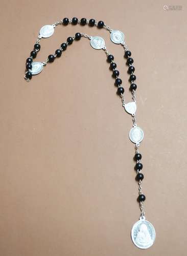 Rosary with black beads and oval aluminum pendant