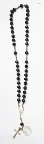 Rosary with black wooden beads and oval aluminum pendant and...