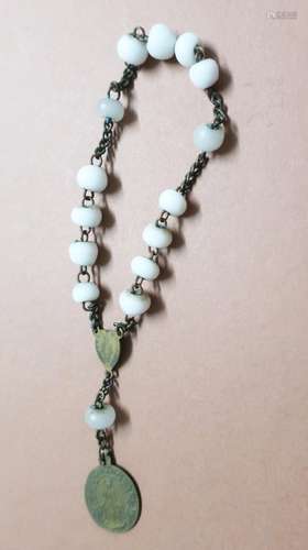 Small rosary with white beads and an oval pendant