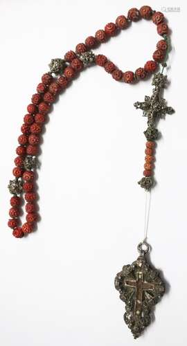 Rosary with carved and colored beads with silver pendant; Th...