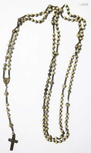 Very long rosary with partially carved leg beads