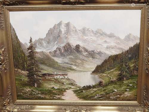 "Alpine pasture with mountain lake below a mountain mas...