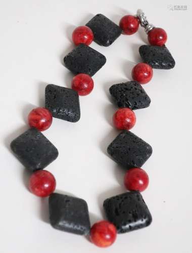 Necklace with rectangular lava elements and coral beads