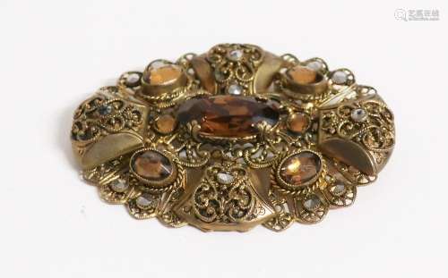 Brooch with cut honey colored stones