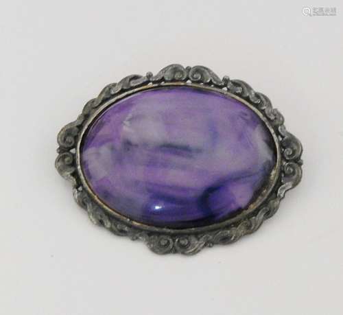 Brooch with purple stone