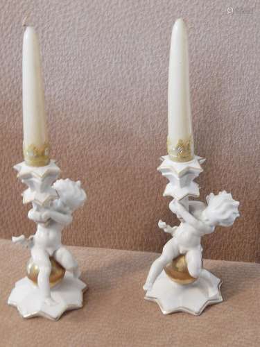 Pair of candlesticks with putti