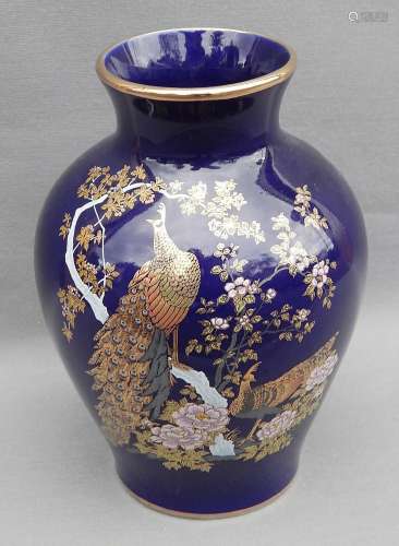 Flower vase with birds of paradise