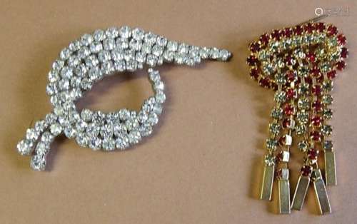 2 brooches decorated with rhinestones