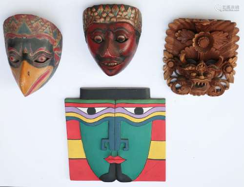 Mixed lot of 4 wooden masks, East Asian handicrafts of the 2...