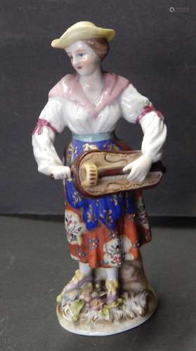 Figural porcelain "Peasant woman with hurdy-gurdy"...