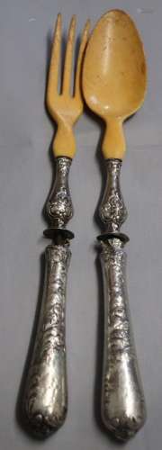 Salad servers with leg loafs and silver handles (damaged)