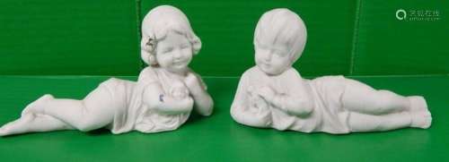 Figurative bisque porcelain "2 lying children",sli...