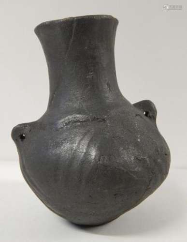 Bellied vessel with high neck