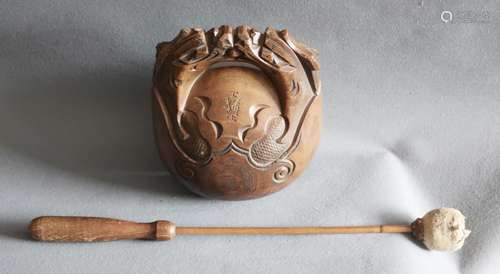 Wooden ritual bell with carving signature