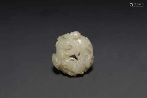 A CARVED WHITE JADE 'DRAGON' PENDANT.HAN DYNASTY