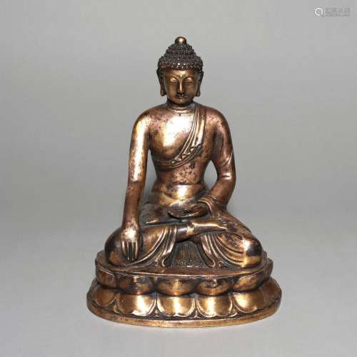 A GILT-BRONZE FIGURE OF SAKYAMUNI.MING DYNASTY