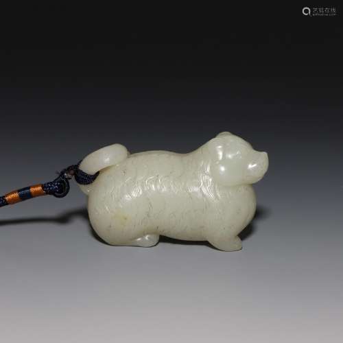 A CARVED WHITE JADE TIGER