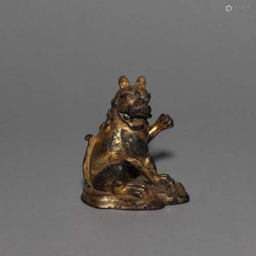 A GILT-BRONZE SEATED BEAST.TANG DYNASTY