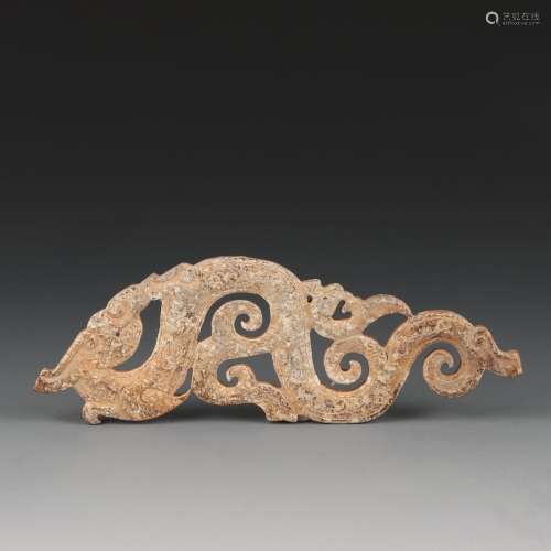 A CARVED JADE 'DRAGON' PENDANT.WARRING STATES PERIOD