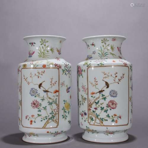 pair of pastel flower and bird pattern cylinder bottles