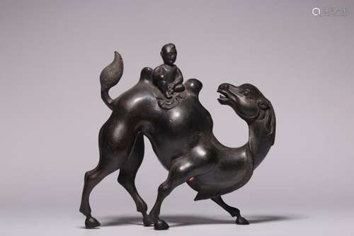 boy riding camel bronze ornament