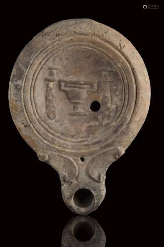 ROMAN TERRACOTTA OIL LAMP WITH KANTHAROS AND TWO DAGGERS (EI...