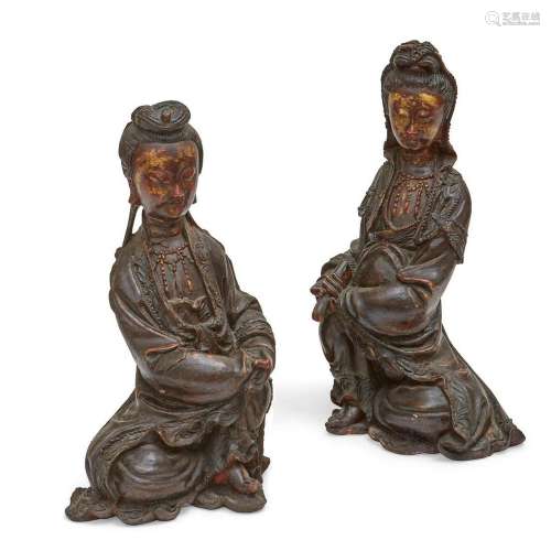 A pair of Asian painted models of seated figures